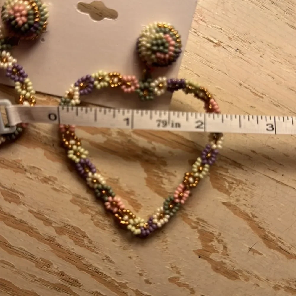 Noir floral heart shaped earrings
